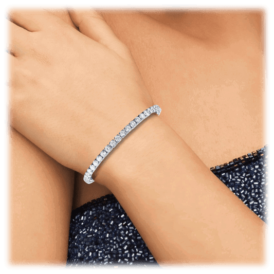 Silver cubic zirconia tennis bracelet with a slim row of round stones on wrist.