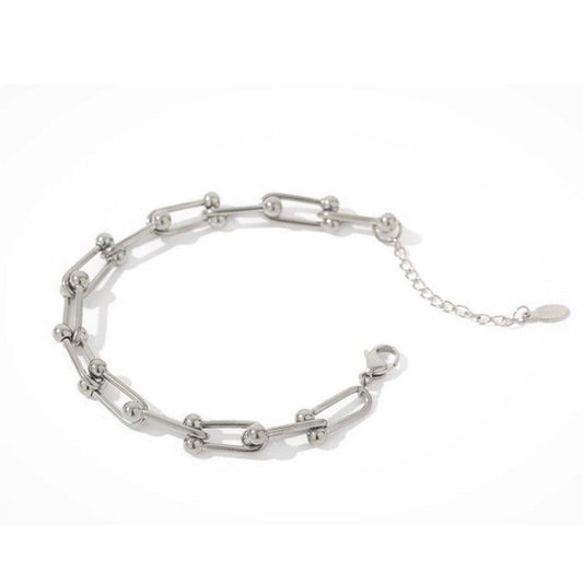 Silver chain link bracelet with oval charm and short extender chain