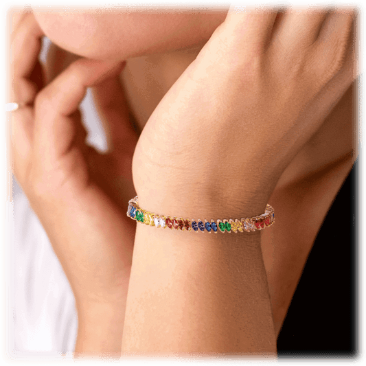 Rainbow tennis bracelet on wrist with small marquise multicolor stones