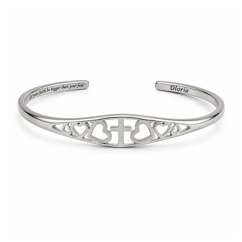 Silver adjustable cuff bracelet featuring engraved cross and heart filigree and inner quote