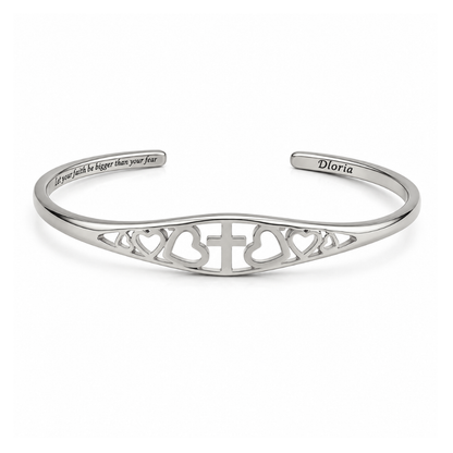 Silver adjustable cuff bracelet featuring engraved cross and heart filigree and inner quote