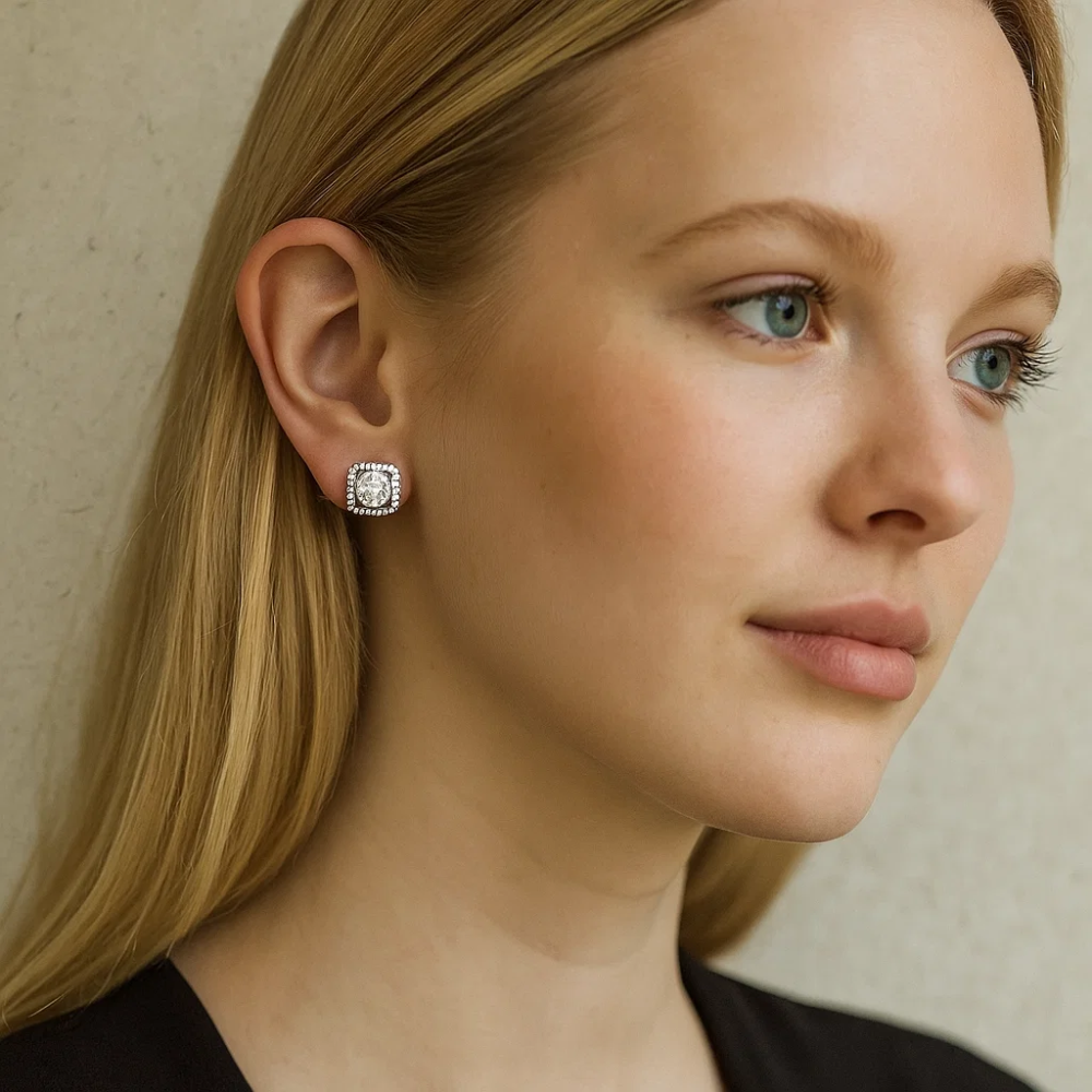 A woman with straight blonde hair wears a black top and the Katlyn Crystal Stud Earrings. She looks slightly to the side with a neutral expression against a light-colored background.