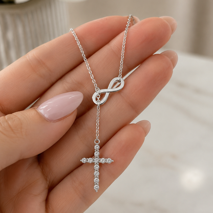 Silver lariat necklace with infinity link and crystal cross pendant