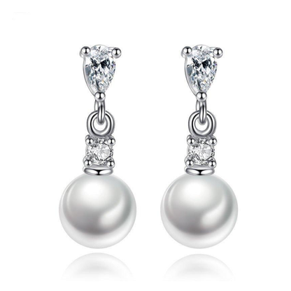 Gold-plated faux pearl drop earrings featuring pear-cut cubic zirconia and round cubic zirconia accents with a classic elegant design.