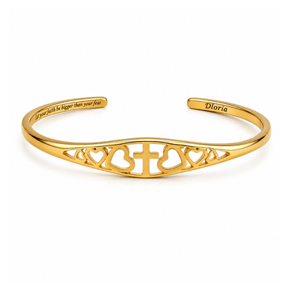 Gold faith bracelet with cross and heart cutout engraving, adjustable cuff bangle