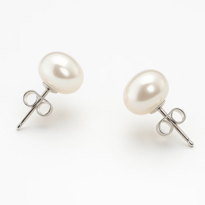 A pair of White Freshwater Pearl Stud Earrings (6-7mm) with 925 Sterling Silver plated posts and butterfly backings, shown against a plain white background.