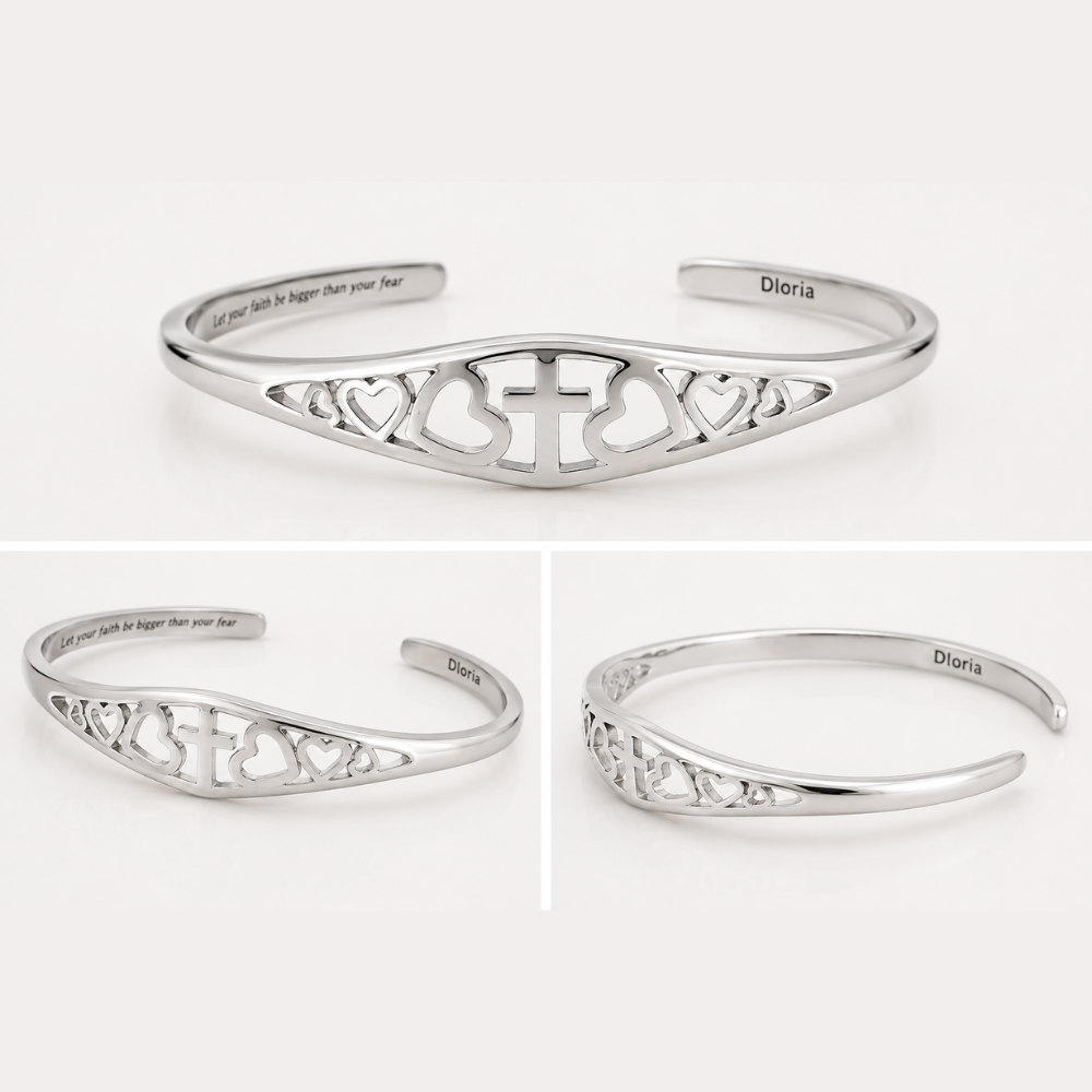 Silver adjustable cuff bracelet with cross-and-heart cutouts and inner message