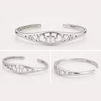 Silver adjustable cuff bracelet with cross-and-heart cutouts and inner message