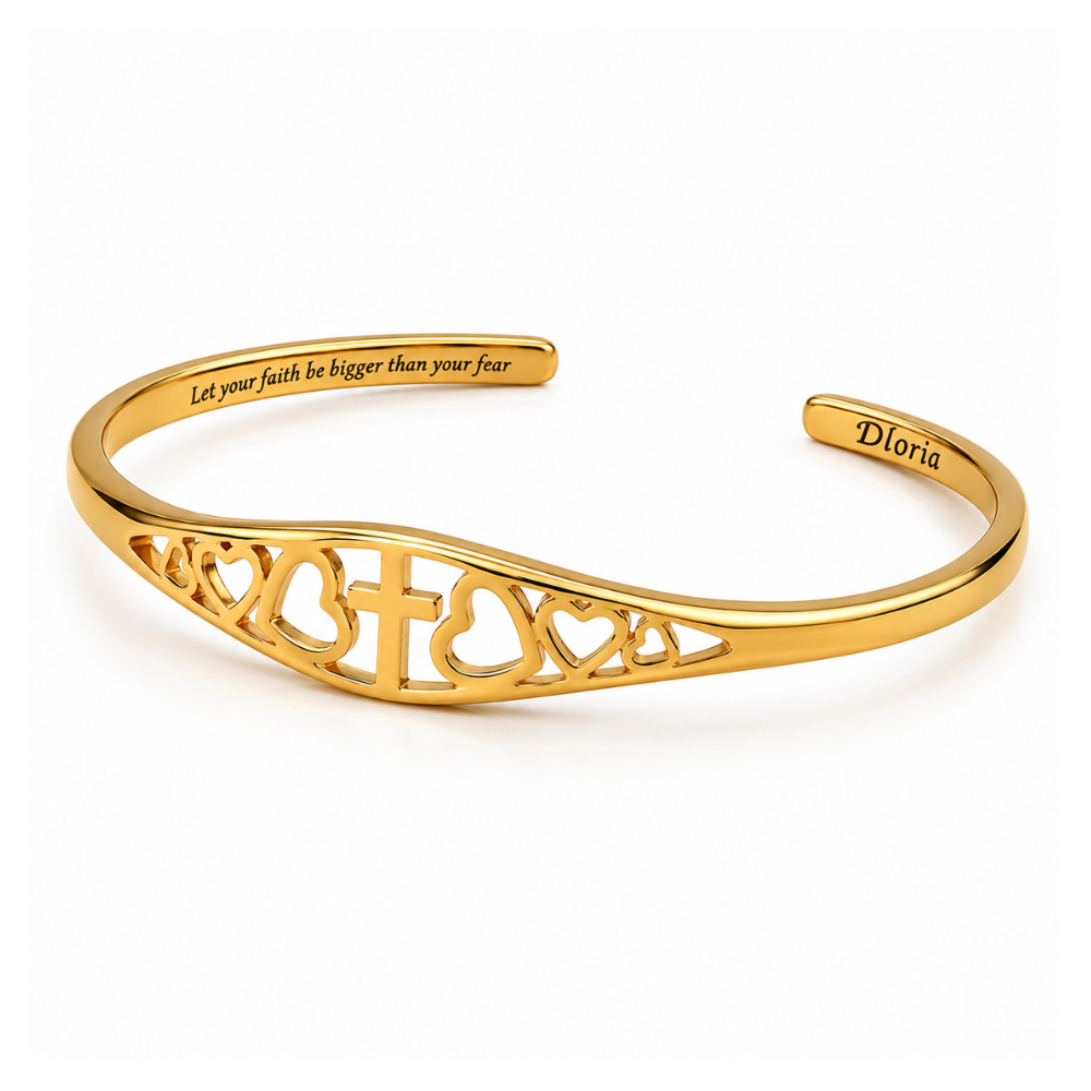 Gold cross-and-heart engraved adjustable cuff bracelet with 'Doria' inside