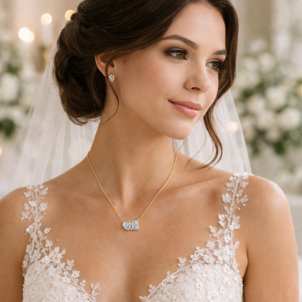 Gold vermeil heart and emerald-cut moissanite necklace worn at the collar, pendant centered