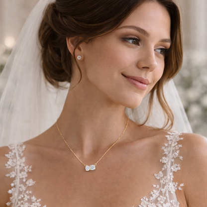 Gold vermeil necklace worn by bride with pear- and round-cut clear stones pendant
