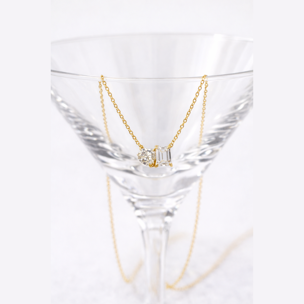 Gold vermeil necklace with heart and emerald-cut stones on a fine chain