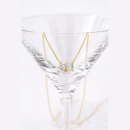 Gold vermeil necklace with heart and emerald-cut stones on a fine chain