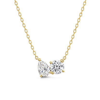Gold vermeil necklace with pear- and round-cut clear stones on a curb chain