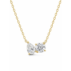 Gold vermeil necklace with pear- and round-cut clear stones on a curb chain