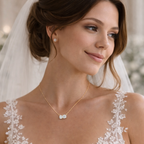 Gold vermeil necklace worn by bride with pear- and round-cut clear stones pendant