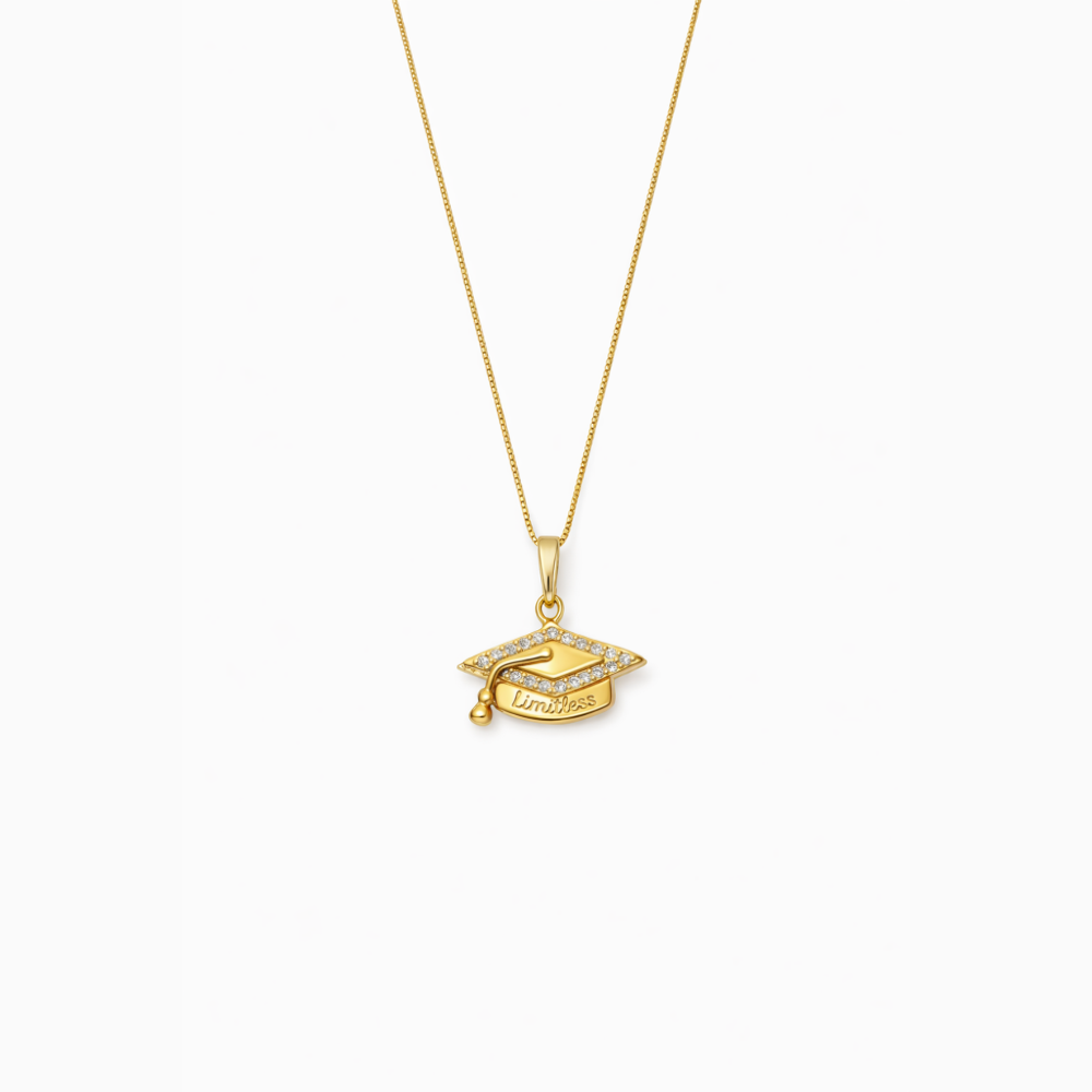 Gold necklace with a graduation cap pendant on a white background