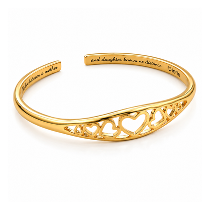 Gold adjustable mother-daughter cuff bracelet with engraved message and heart motif center