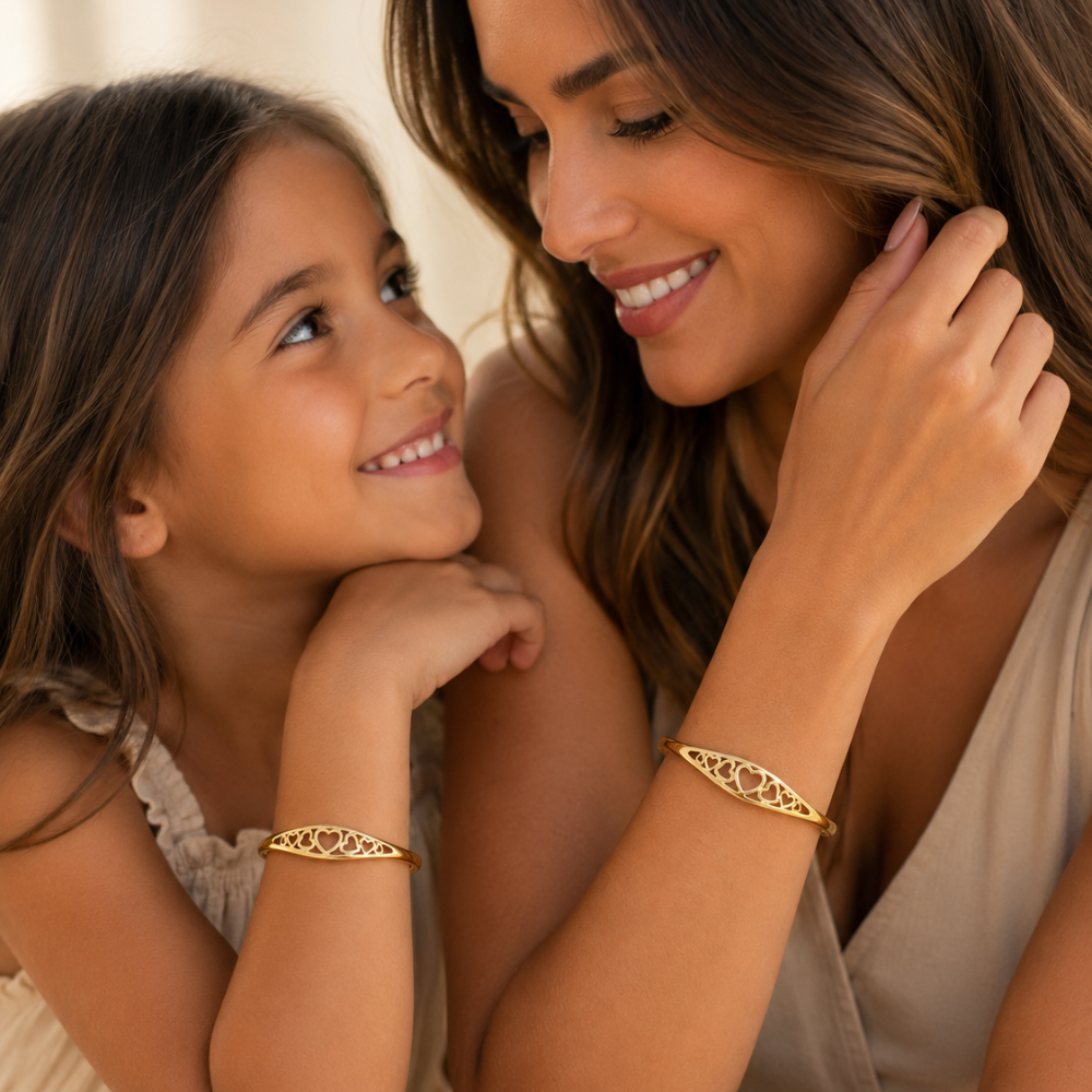 Gold engraved heart cuff bracelet worn by mother and daughter, adjustable open bangle