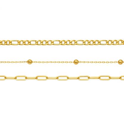 Close-up view of three gold-tone bracelet chains with bead and link details