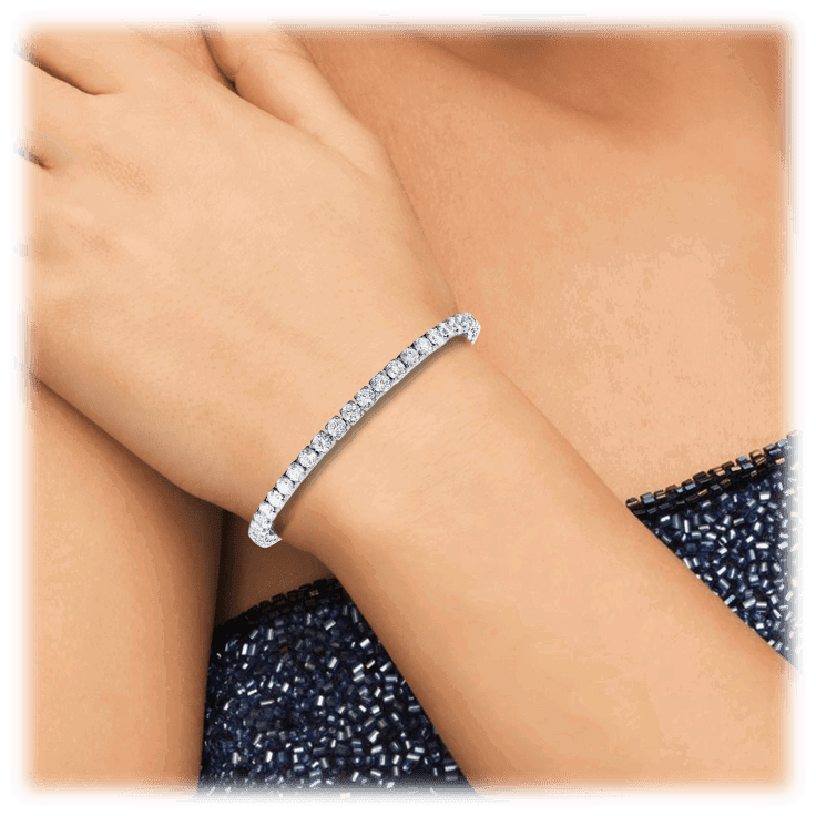 Silver cubic zirconia tennis bracelet with a slim row of round stones on wrist.