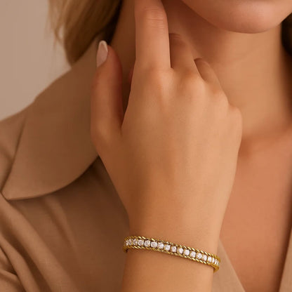 Gold-tone CZ bracelet with sparkling clear stones along top, slim chain band.