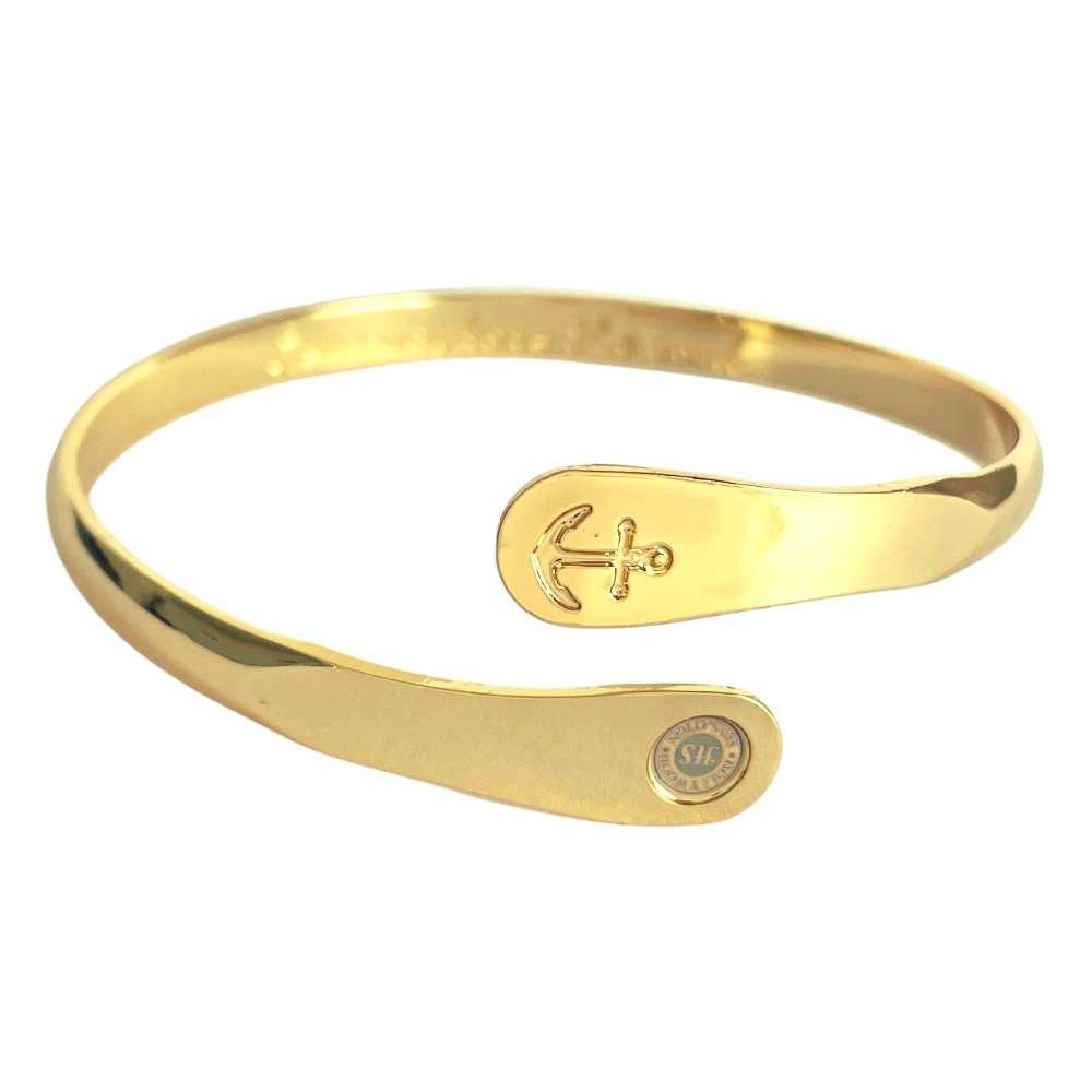 Gold anchor engraved cuff bracelet with oval charm plate and curved band