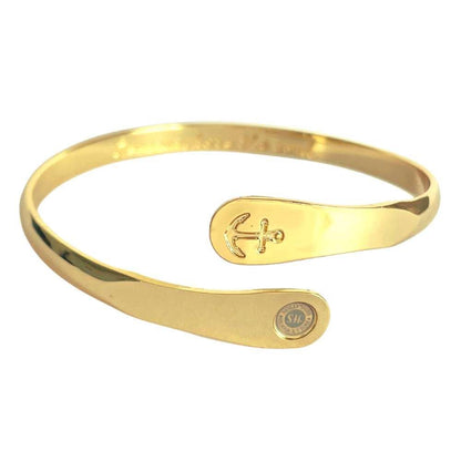 Gold anchor engraved cuff bracelet with oval charm plate and curved band