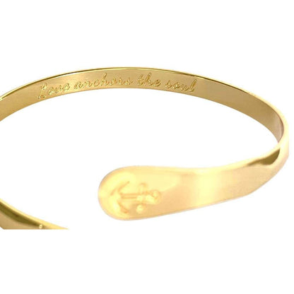 Gold anchor cuff bracelet with engraved inner message along the band