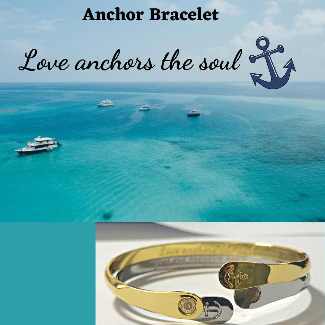 Gold tone anchor bracelet with engraved love anchor charm on display