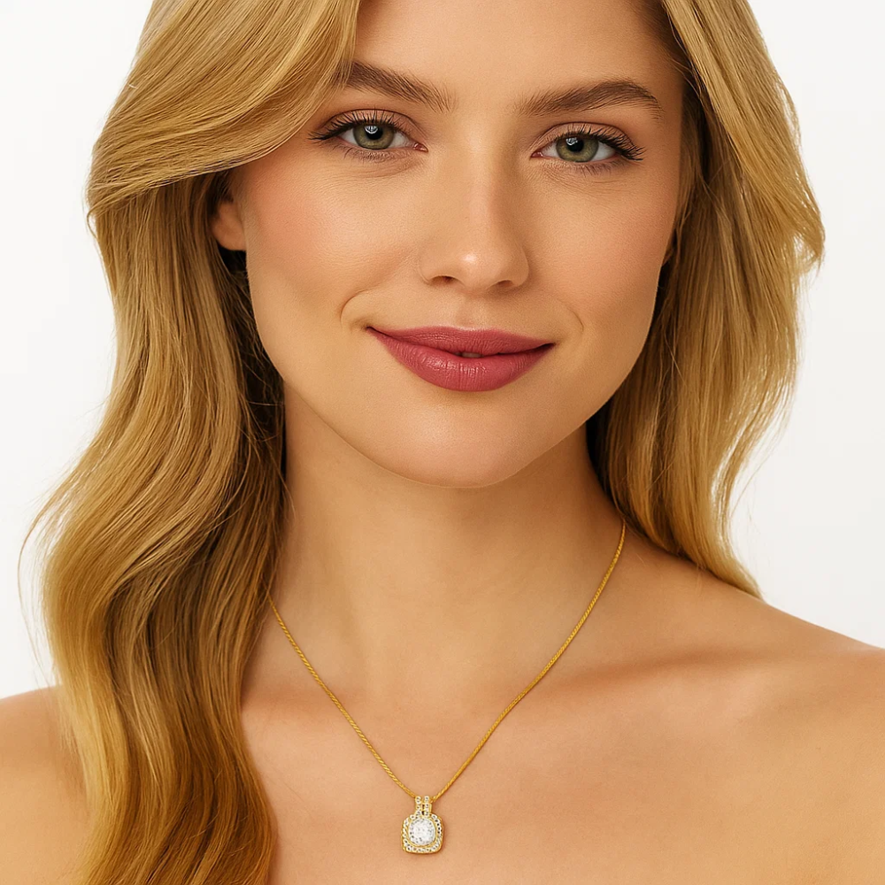 Gold halo pendant necklace with square crystal center and stud earrings on model