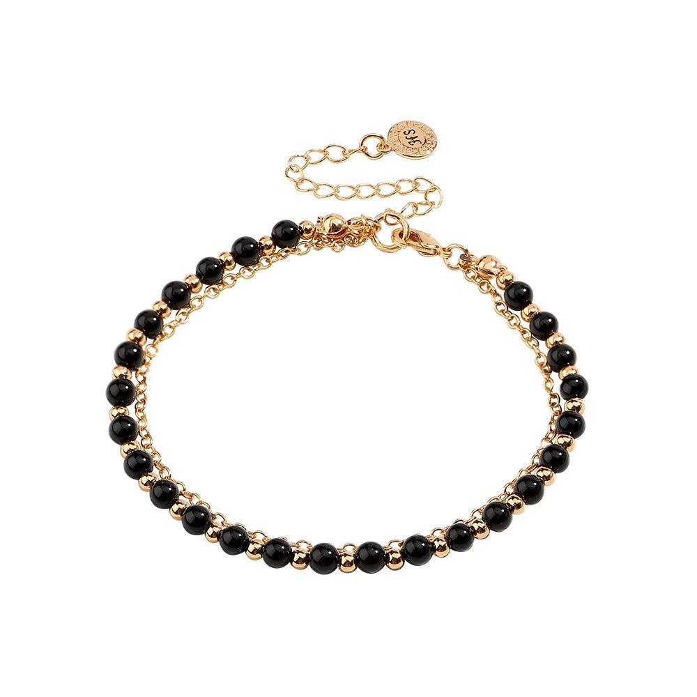 Gold beaded friendship bracelet with black beads and round charm centerpiece