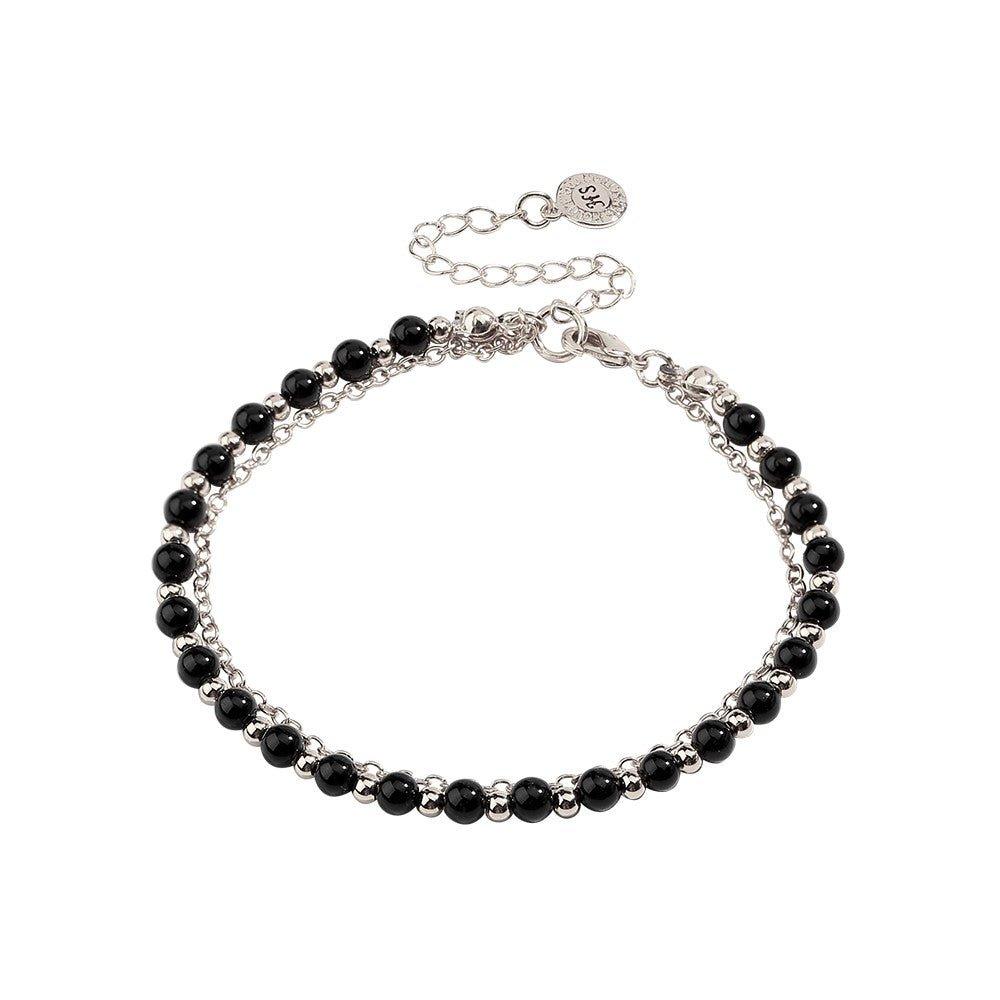 Silver-tone beaded friendship bracelet with black beads and round charm tag clasp