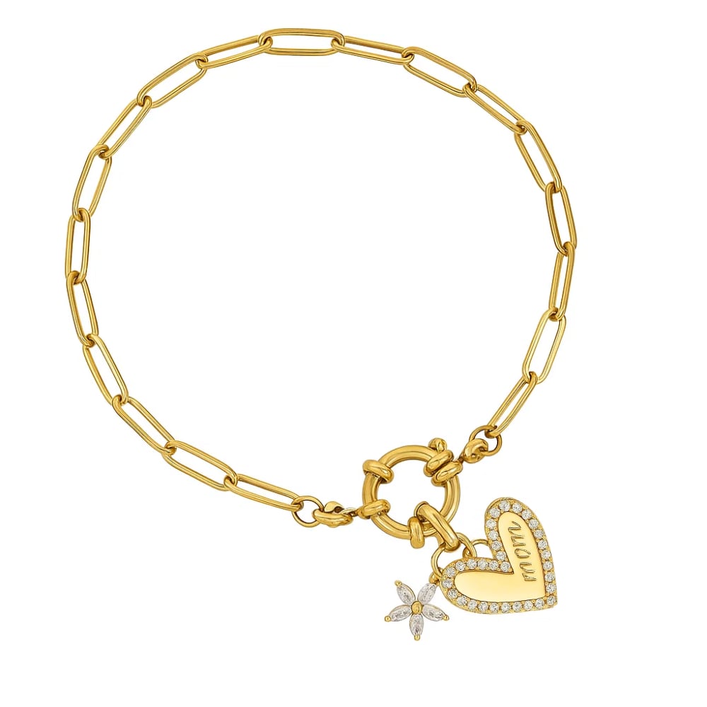 Gold chain bracelet with heart charm and star sparkle, close-up on clasp side