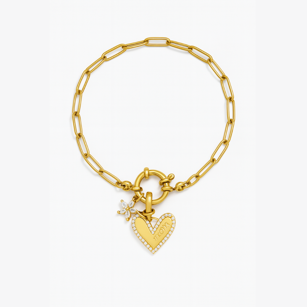 Gold chain bracelet with heart charm, star accent, and text detail