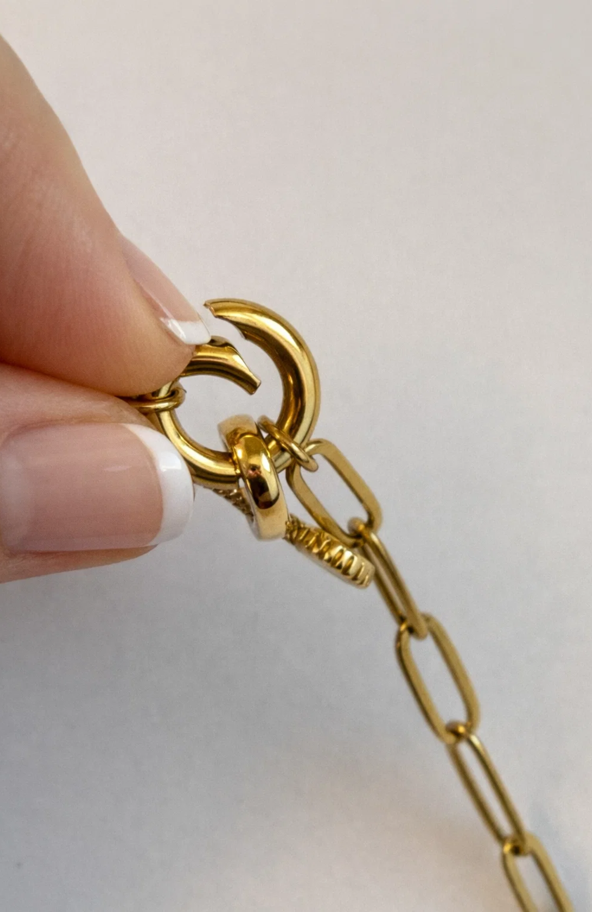 Gold heart pendant necklace with chain, close-up