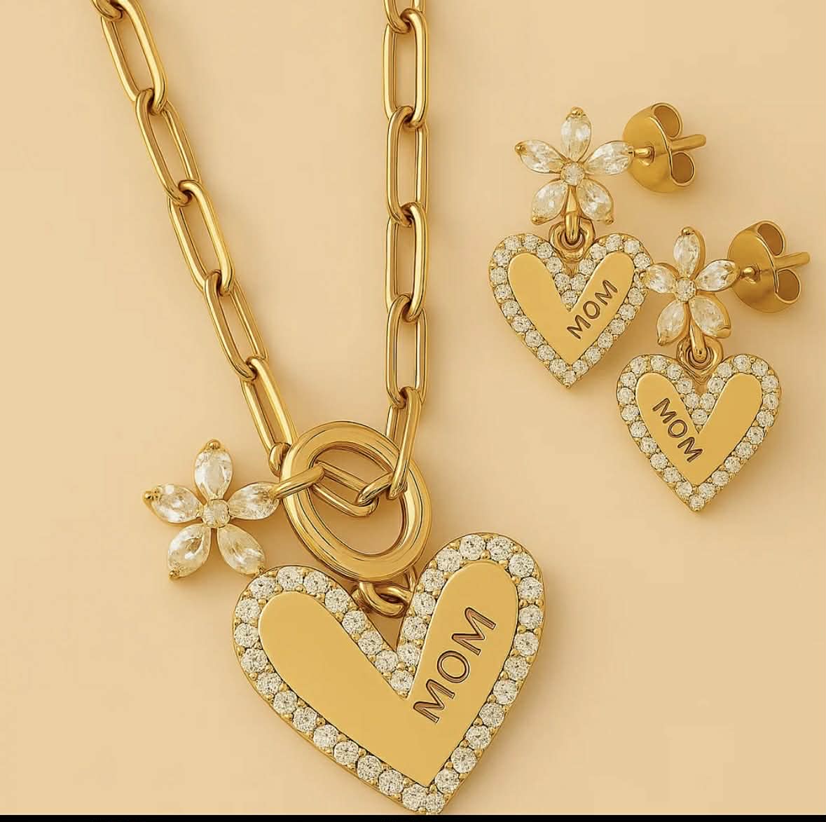 Gold heart pendant necklace with crystal heart charms and matching flower stud earrings