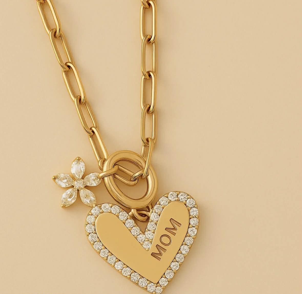 Gold chain heart pendant necklace with crystal halo heart charm and flower detail