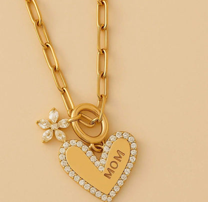 Gold chain heart pendant necklace with crystal halo heart charm and flower detail
