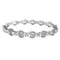 Silver tennis bracelet with bow-tie cubic zirconia links and clear stones