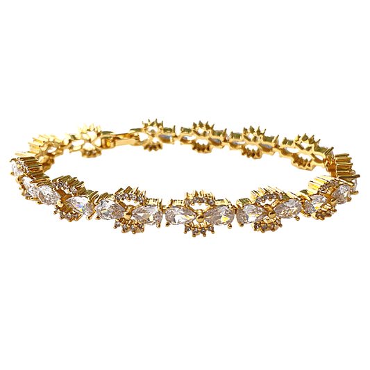 Gold tennis bracelet with bow-tie cubic zirconia links and clear stones
