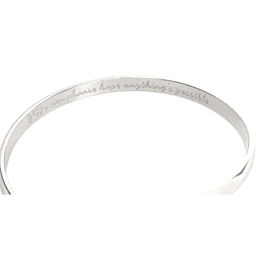 Silver engraved bracelet band with cursive message around the cuff