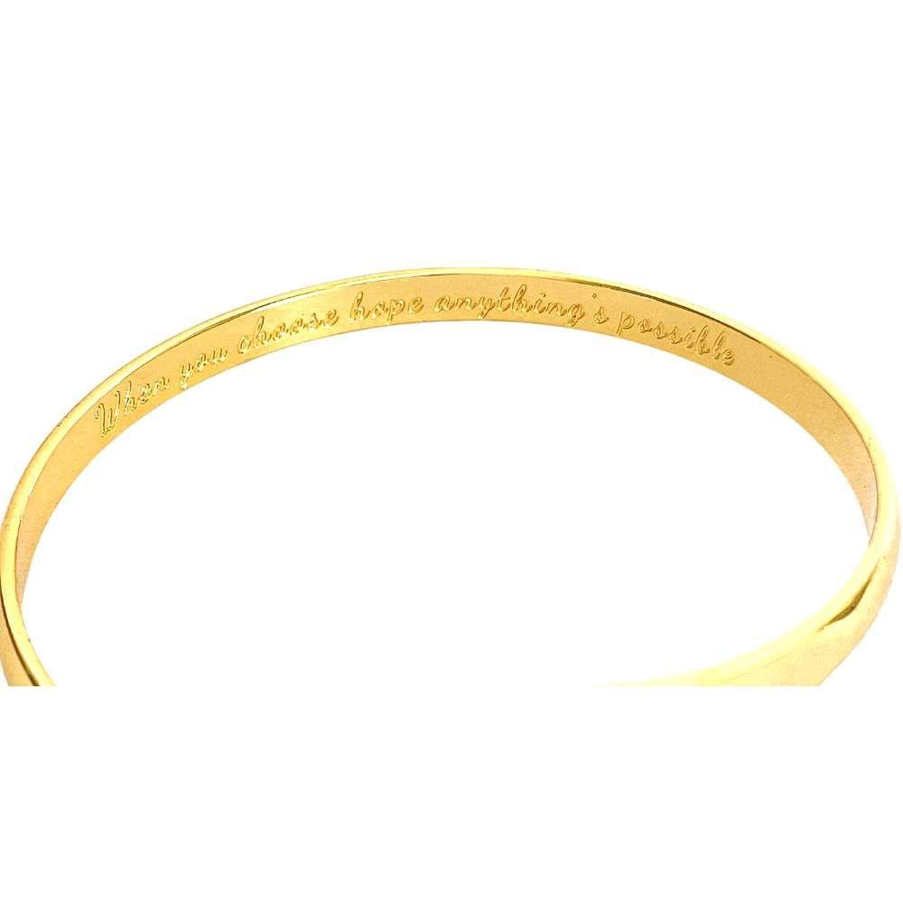Gold engraved bracelet band with cursive message around the cuff