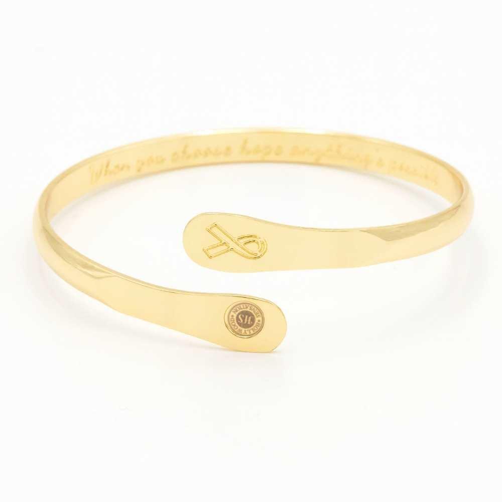 Gold-tone engraved awareness ribbon charm cuff bracelet