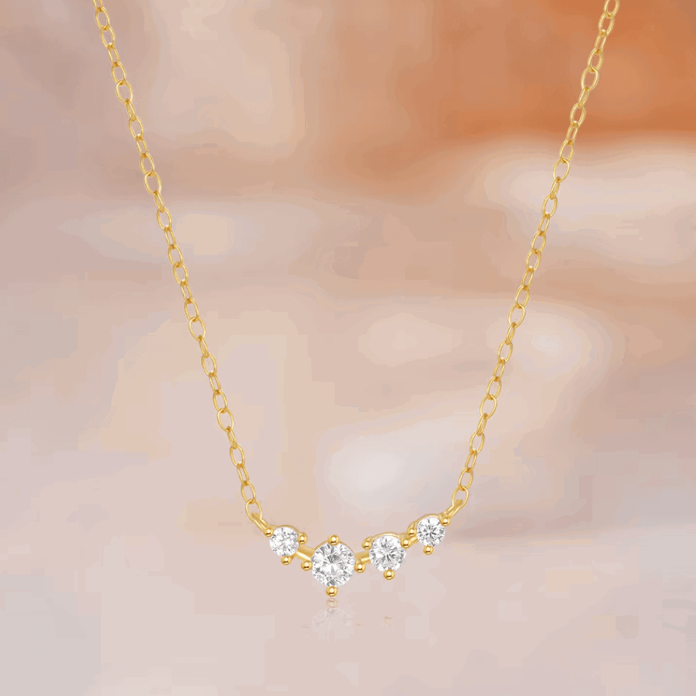 Gold-tone chain necklace with central star-shaped clear stone cluster