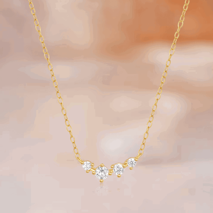 Gold-tone chain necklace with central star-shaped clear stone cluster