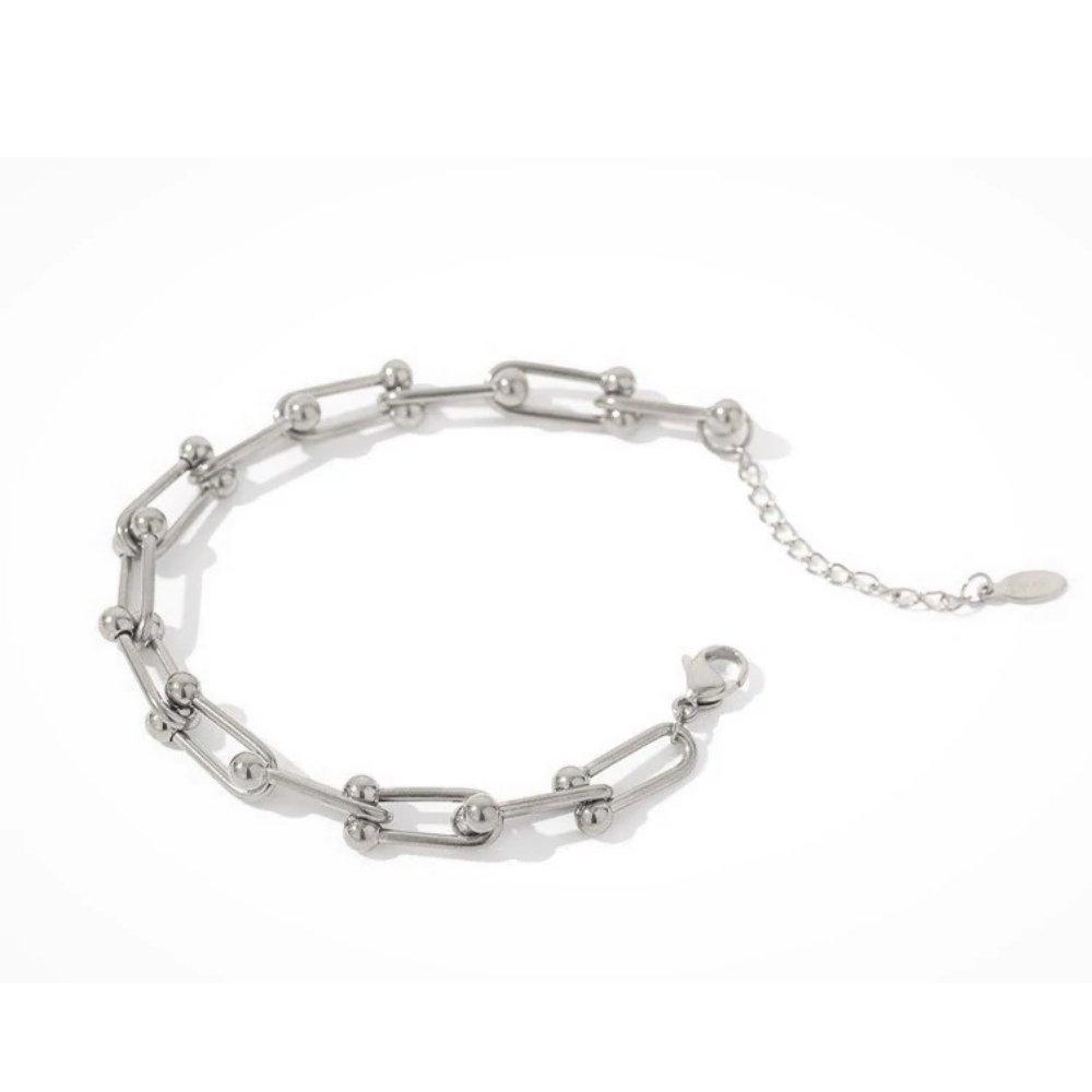 Silver chain link bracelet with oval charm and short extender chain
