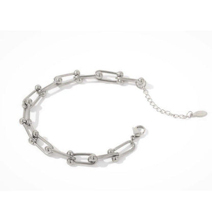 Silver chain link bracelet with oval charm and short extender chain