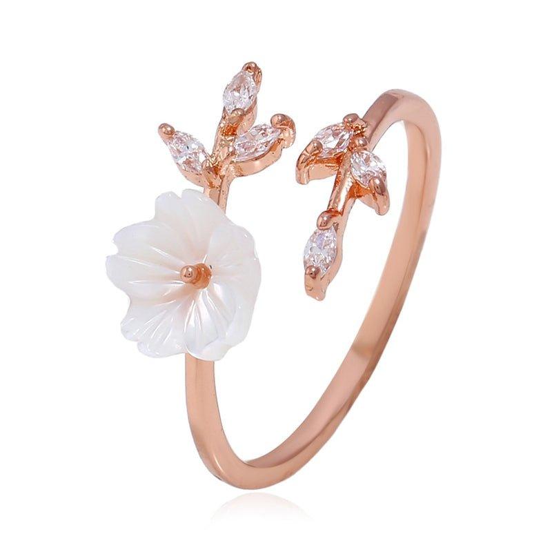 Adjustable floral ring with white flower design and rose-gold tone band