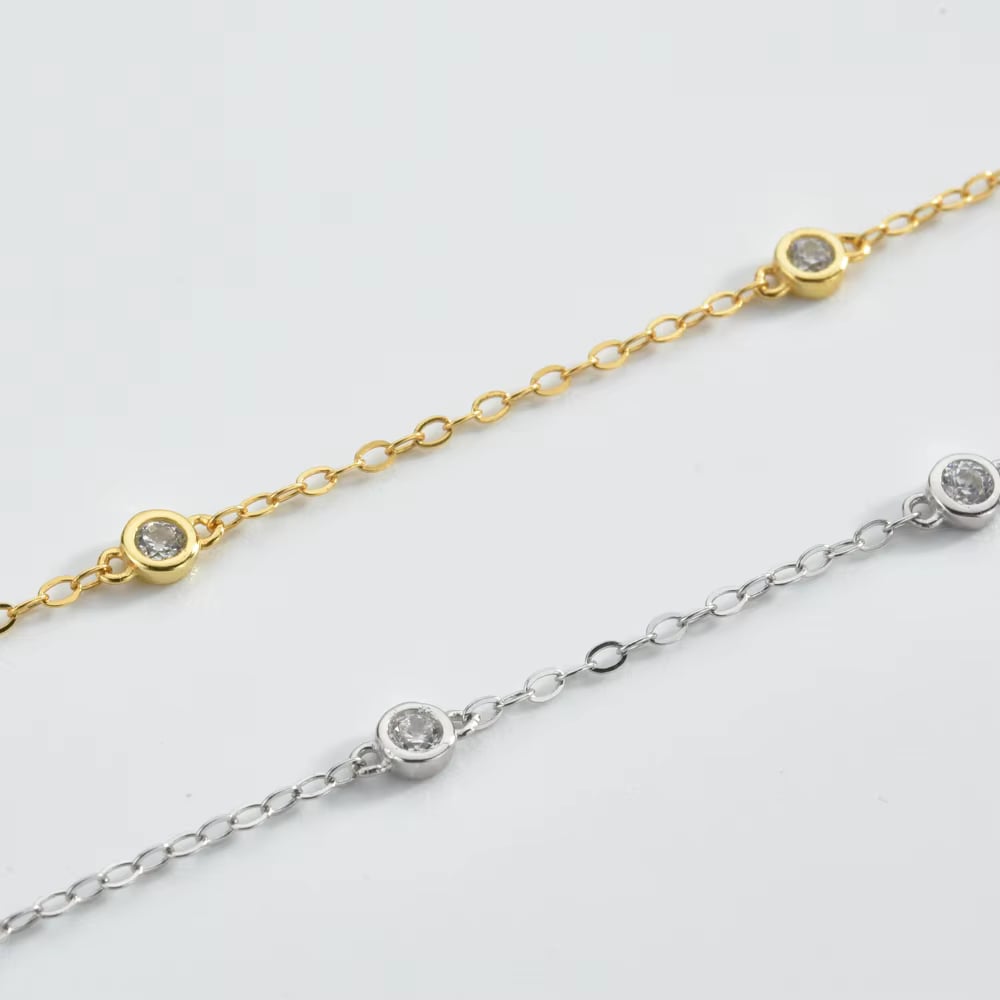 Gold and silver cubic zirconia bezel link bracelets with round sparkling stones
